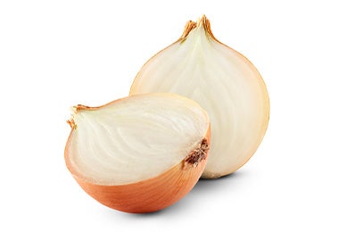 Cebolla marrón cortada por la mitad Cebolla marrón cortada por la mitad