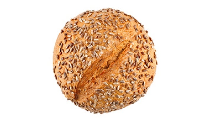 El pan de masa madre se puede decorar con semillas. Pan de masa madre con semillas.